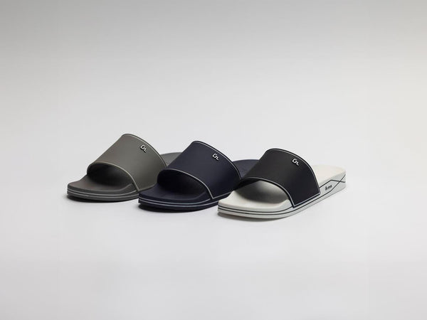 Glides brand slides in Gray, Navy, and White on a white background.