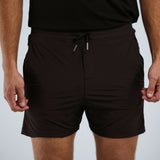 Model wearing Glides Performance Shorts in Black.