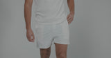 Man modeling Glides White Performance Shorts